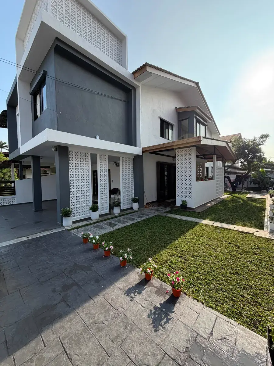 Finished semi-detached house in Taman Gembira, Klang, with a new facade, breeze-block screens and a fresh lawn